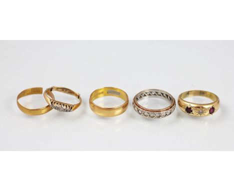 A collection of rings, to include; an 18ct yellow gold ruby and diamond ring, within star gypsy settings, weight 3.3gms, a 22