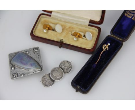 A seed pearl set stock pin, two shirt studs, two mother of pearl studs, a Ruskin style brooch and a coin set brooch along wit