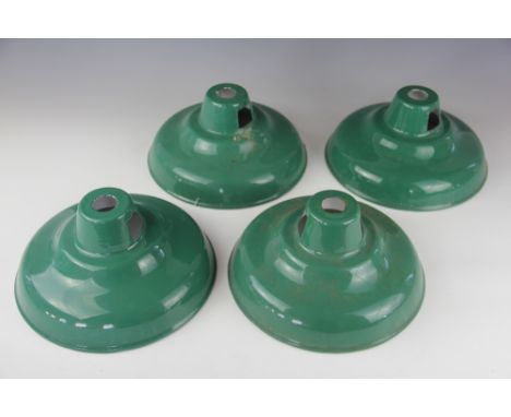 A set of four vintage green enamel ceiling light shades of coolicon type, 26cm diameter