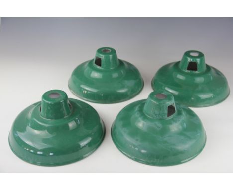 A set of four vintage green enamel ceiling light shades of coolicon type, 26cm diameter