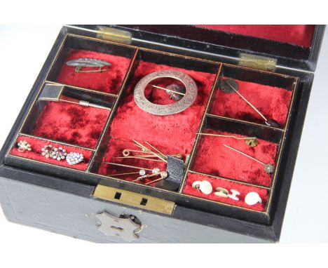 A jewellery box containing a collection of jewellery to include; a selection of stick pins including a citrine and seed pearl