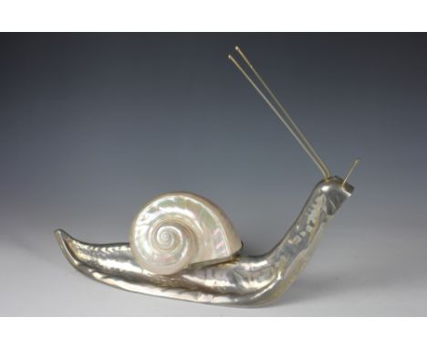 A white metal model of a snail, with mother of pearl shell, 47cm