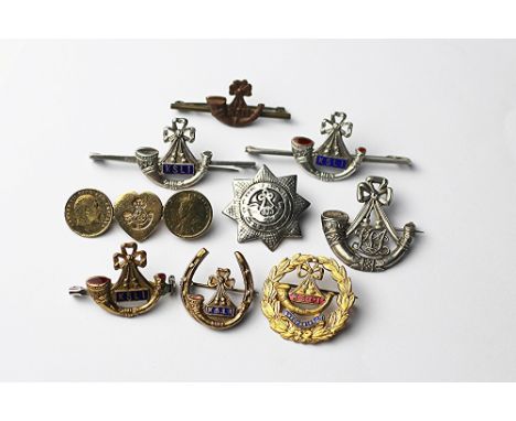A collection of nine Kings Shropshire Light Infantry sweetheart badges, including four silver and one silver gilt (9) 
