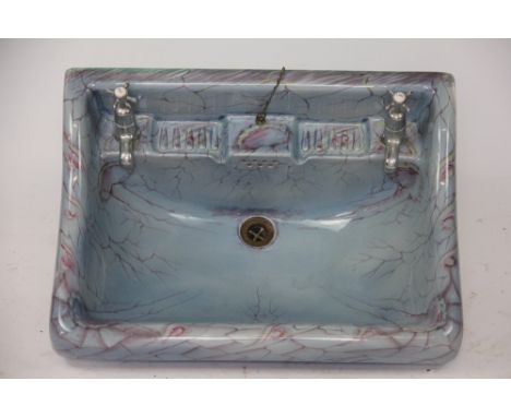 A vintage Cauldon ceramic sink, with veined red detailing against a blue ground, 64cm wide, (small crack to one back corner)