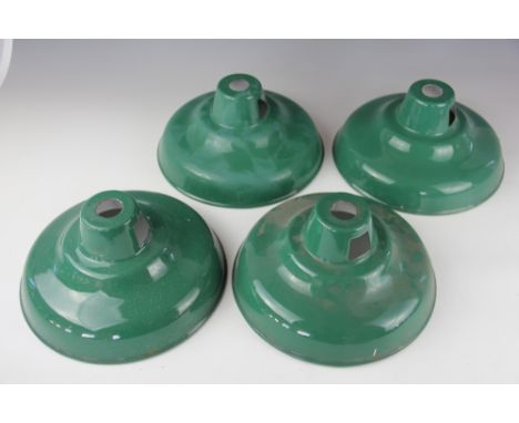 A set of four vintage green enamel ceiling light shades of coolicon type, 26cm diameter