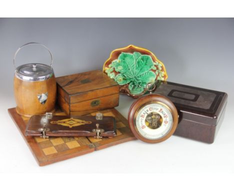 A 19th century Majolica leaf moulded dish, a walnut aneroid barometer, a plate mounted oak biscuit barrel and other items  