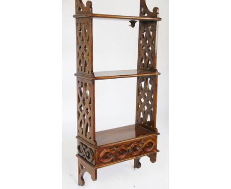 A modern stained beech hanging shelf unit, with pieced sides and drawer, 98cm H x 40cm W