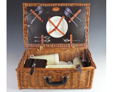 A Harrods picnic hamper, the ceramic plates and cups moulded with fruit, 55cm