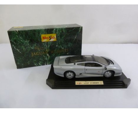 A Maisto 1:12 scale model of Jaguar XJ220 in original packaging