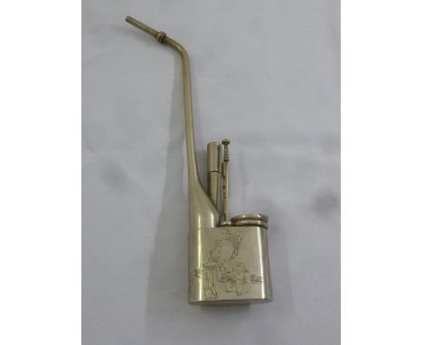 A Chinese metal opium pipe with accompanying instruments