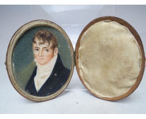 (XIX). An oval portrait miniature on ivory of a young gentleman with white stock, unsigned, set in leather covered case, 6 x 