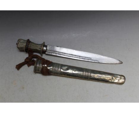 A TIBETAN TYPE DAGGER AND SCABBARD, L 34 cmCondition Report:bumps to pommel and scabbard