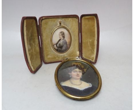 A 19TH CENTURY OVAL HEAD AND SHOULDER PORTRAIT MINIATURE ON IVORY OF AN ELEGANT LADY, unsigned, framed and glazed, 8 x 6 cm, 