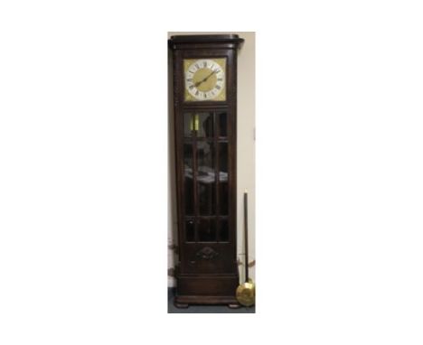 AN EARLY TWENTIETH CENTURY OAK GLAZED LONGCASE CLOCK, with triple weight, the gilt and silvered dial with a Westminster / Whi