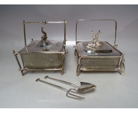 A SILVER PLATED AND GLASS SARDINE DISH WITH CROSSED SARDINE FINIAL TO LID, raised on four sardine 'feet', together with a sec