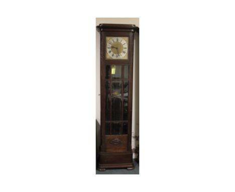 AN EARLY TWENTIETH CENTURY OAK GLAZED LONGCASE CLOCK, with triple weight, the gilt and silvered dial with a Westminster / Whi