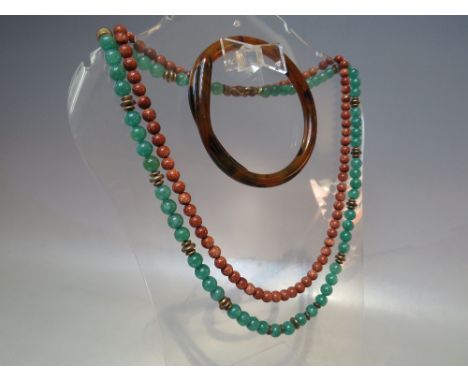 A VINTAGE GOLDSTONE SINGLE STAND BEAD NECKLACE, approx length 52 cm, together with another polished green hardstone bead neck