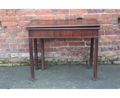 A 19TH CENTURY MAHOGANY FOLD-OVER CARD TABLE, raised on square supports, H 74 cm, W 91 cm