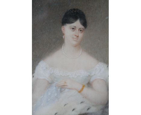 ENGLISH SCHOOL (XIX). A portrait of a young lady in a white lace dress, gilt framed, paper label verso, 10.5 x 8.5 cm