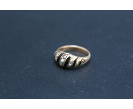 A 15 CT SEED PEARL AND ENAMEL MOURNING RING, with integral keepsake area to the inner band, approx weight 2.9g, ring size K 