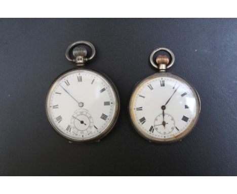 A HALLMARKED SILVER OPEN FACED MANUAL WIND POCKET&nbsp;WATCH, Dia 5 cm together with a similar slightly smaller example A/F (