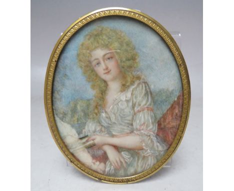 (XIX). An oval portrait miniature on ivory of a young woman holding a book, landscape in background, unsigned, framed and gla