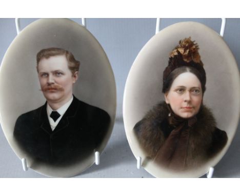 A PAIR OF LATE 19TH CENTURY OVAL PORCELAIN PORTRAIT PLAQUES, depicting a German lady and gentleman, paper labels verso, unfra
