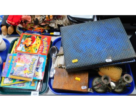 A collection of Pokemon related items, to include Scholastic books, Pokemon the First Movie CD, cased and loose flatware, par