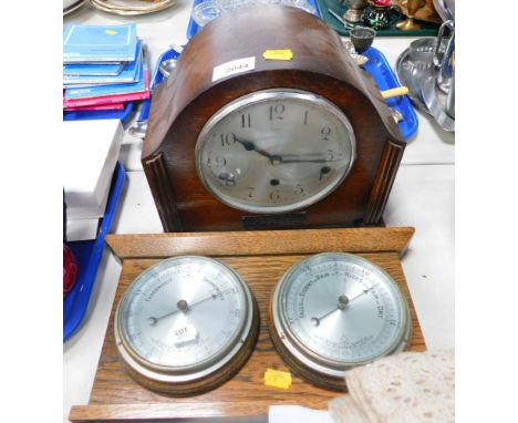 An Enfield oak cased wall clock, with Arabic numeral dial, and an oak cased thermometer and barometer.