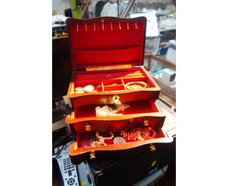 A jewellery box containing a quantity of costume jewellery, to include a Wedgwood Jasperware brooch, pair of clip on earrings