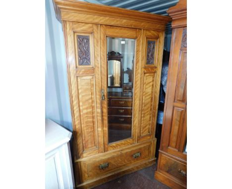 A Victorian satin walnut single wardrobe, with mirror door, and drawer base, 123cm wide. 