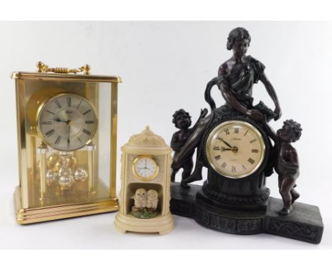 A Kundo anniversary type carriage clock, figural clock and a small owl house clock. (3)