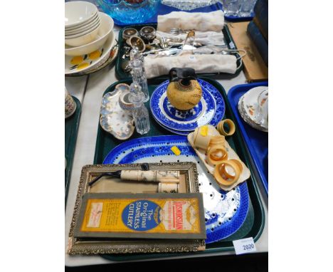 A collection of silver plated wares, to include a pair of open salts, loose flatware, tea strainer, sugar nips, bone napkin r