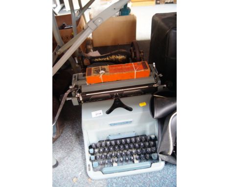 An Imperial 70 typewriter and a Singer sewing machine. (2)