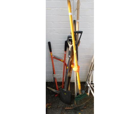 A collection of hand tools, to include rakes, hoes, spades, pick axe, hack saw, etc. (12)