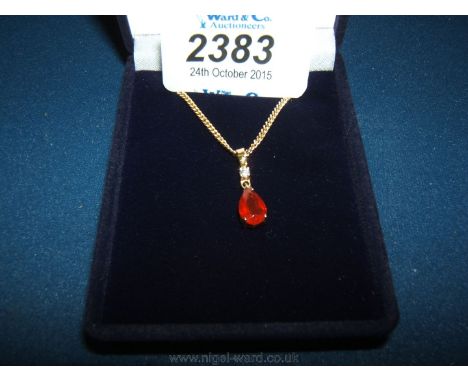 An 18ct fire opal and Diamond Pendant with chain