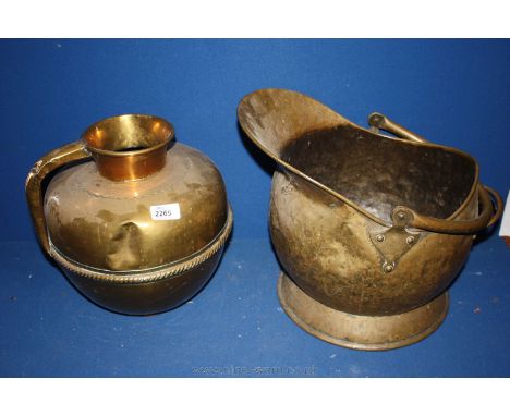 An old Brass helmet shaped Coal Scuttle and a copper Urn