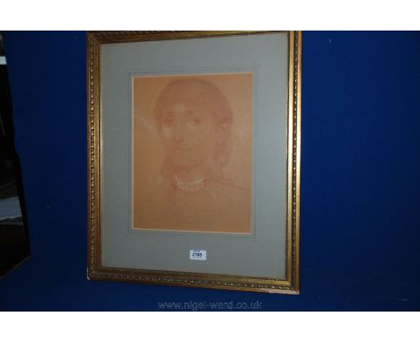 A framed and mounted red charcoaled sketch portrait of a  young girl 17" x 20 1/2"