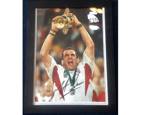 Rugby England Great Martin Johnson 18x14 overall framed 16x12 colour photo lifting the Webb Ellis trophy after the 2003 world