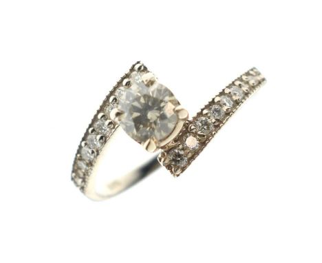 Diamond crossover ring, the white mount stamped '585', size M approx, 2g gross approx, cased, and with an AIG certificate No.