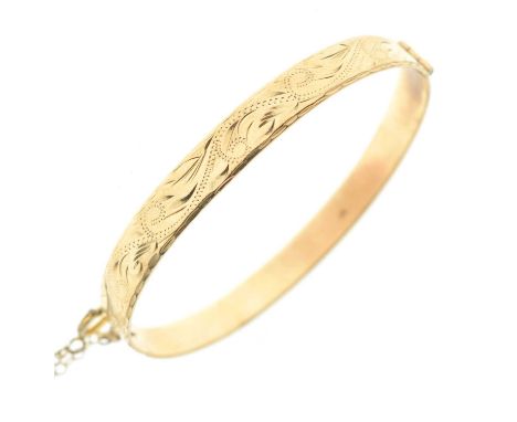 9ct gold snap bangle, the top section having engraved decoration, 17.8g approx (a/f)