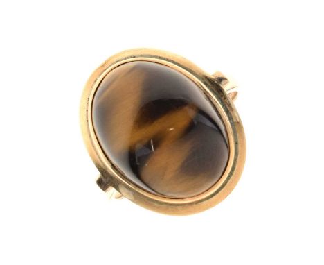 Tigers eye cabochon ring, the yellow metal mount stamped '9ct', size R approx, 5.9g gross approx