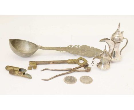 Two United Arab Emirates (UAE) white metal coffee pots, 15cm high, two Maria Theresa Dollar/Taler, an Arabic ladle, an Omani 