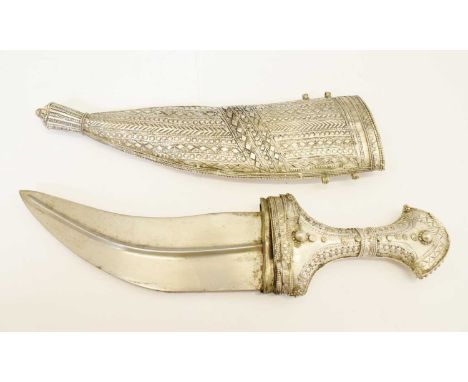 20th century Yemeni jambiya, 18cm curved double-edged blade with central rib, embossed white metal hilt with matching scabbar