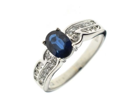 Sapphire and diamond dress ring, the white metal mount stamped 'Pt 900', size O½ approx, 5.8g gross, cased, and with an AIG c