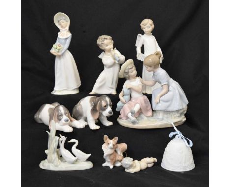 Lladro - Group of five porcelain figures to including winged angles and a pair of dogs, with a Christmas decoration and bell,