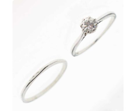 Single stone diamond ring, the brilliant cut measuring 5mm diameter approx, the white metal shank stamped 'Plat', size R appr