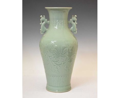 Chinese celadon porcelain vase, baluster form with twin dragon handles, with floriate scroll decoration, 42cm high