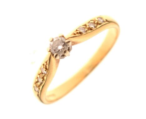 18ct gold single stone diamond ring, having three small diamonds inset to each shoulder, size K½ approx, 2.4g gross approx