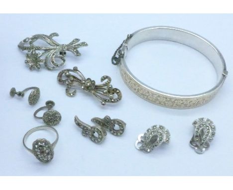 A collection of marcasite set jewellery including silver and a 9ct gold on silver bangle, one brooch lacking pin